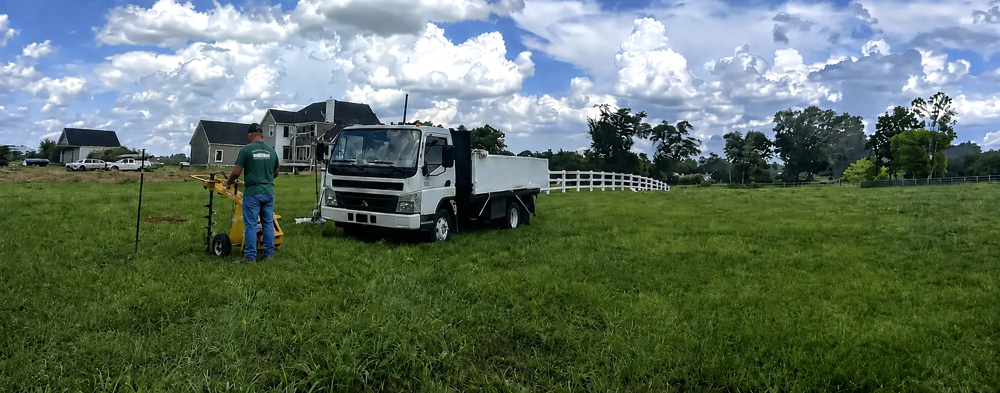 image of fence being installed by Mitchell Fence Company